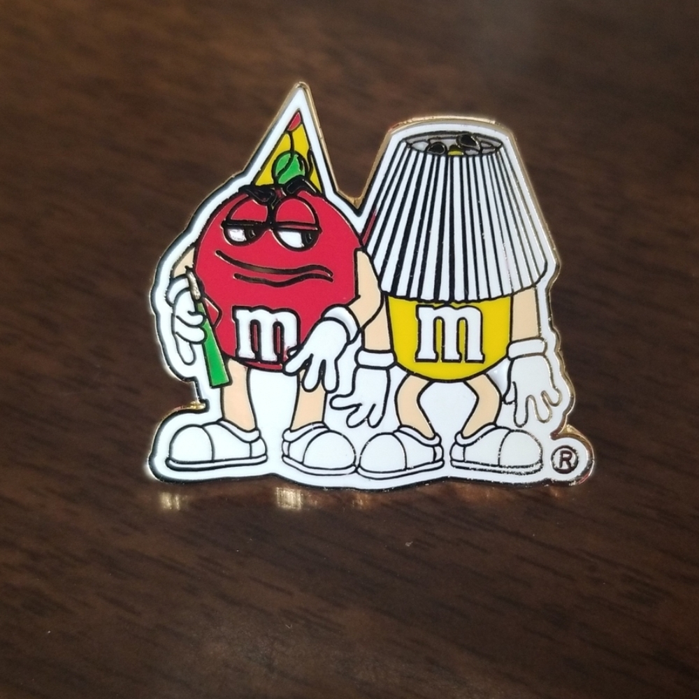 M&M New Year's party lapel pin